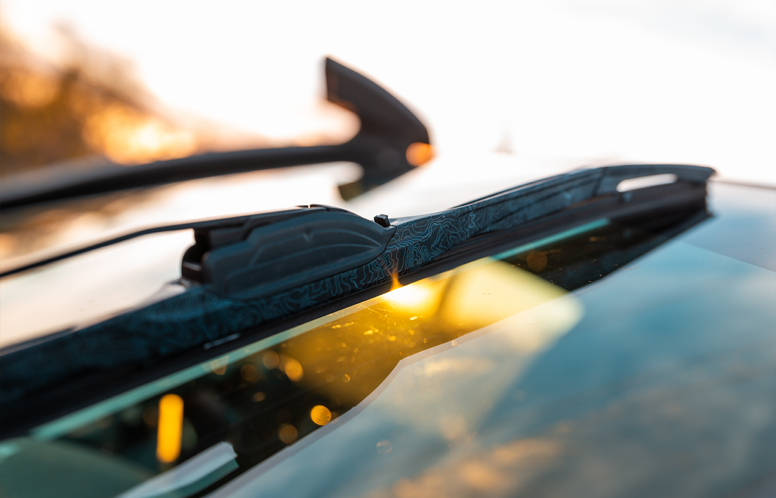 Mox Motors MT86 Wiper Blades on Windshield at Sunset
